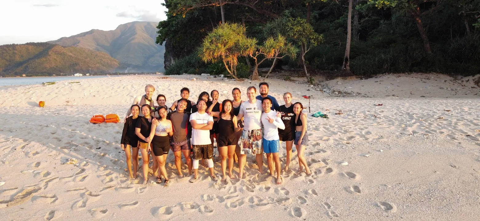 The metaFox team together on a beach at the end of a company offsite